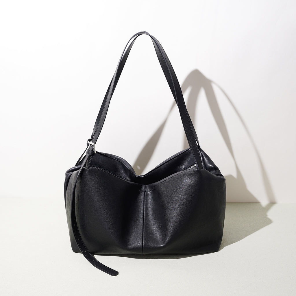 Sac à main oreiller noir en croûte de cuir
